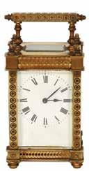 שעון מסעות/מעורר שוויצרי ישן תוצרת Cartier דגם עגול, מסגרת מוזהבת. לוח ספרות רומיות.