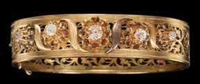 שרשרת זהב 14K, מעוטרת 2 פרחים משובצים רובינים, יהלום במרכז, ופרח משובץ ספירים ויהלום. $ 600 800 517.