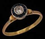 783. טבעת ארט-דקו זהב 18K, אלמנט עגול משובץ אבני ספיר ובמרכז יהלום בליטוש ישן. 784.