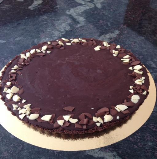 Chocolate tart Rich dark chocolate ganache in a buttery cookie crust Serves 15-20 Option for