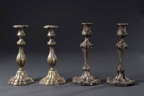 99 98 99. Two Pairs of Candlesticks Poland, 19th Century Two pairs of candlesticks. Poland, 19th century. Silver-plated copper, hammered. One pair contains stamp of craftsman / manufacturer: S.