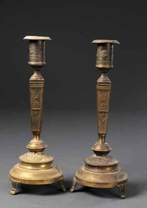 101 100 101. Two Pairs of Brass Candlesticks Morocco and Europe Pair of candlesticks. Morocco. Cast brass, engraved ornamentation. With wide plate on upper part. Pair of candlesticks. Europe. Cast brass. Various sizes.