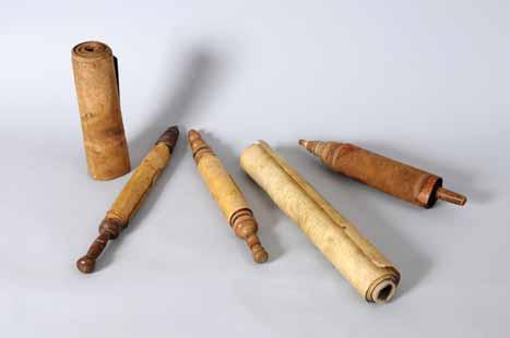 Stylish wooden pole, faded letters replaced in later writing. Megillah on parchment, simple Sefardic writing, [c. 19th-20th century], stylish wooden pole.