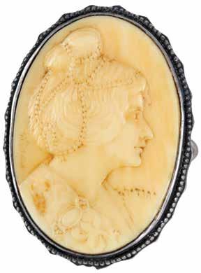 Yehudit Ivory Medallion Crafted by Meir Gur-Arie Ivory medallion with a portrait of Yehudit (profile), crafted by Meir Gur-Arie. Jerusalem, [ca. 1910]. Carved and sculpted ivory; silver frame.
