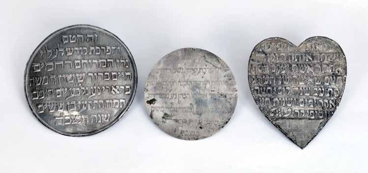 70 70. Three Dedication Plaques for a Torah Ark Curtain ( Parochet ) Middle East 1. A round dedication plaque for hanging on a Torah Ark Curtain, made of silver. Middle East, [1897].