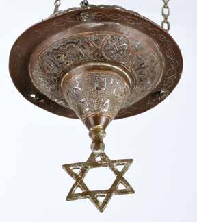 כוס השמן חסרה. פתיחה: $900 81. Synagogue Lamp Damascene craft, Early 20 th Century Synagogue memorial lamp. Middle East, early 20 th century. Damascene craft; copper and silver setting.
