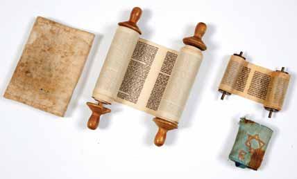 Miniature Torah Scroll extremely small. Printed on thin paper. Rolled on metal Atzei Chaim. [Early 20th century].