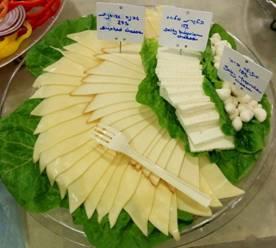 Cheese platter 220 NIS מגש גבינות Decorated cheese platter with a combination of of cheeses such as yellow cheese, feta cheese, mozzarella and