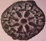מטבע עופרת על הכתובת בארמית "מלכא אלכסנדרוס".